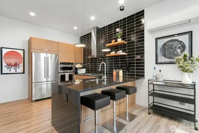 Designer kitchen is equipt with walk-in pantry