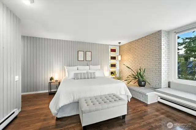 Generously sized Primary bedroom features premium placement for breathtaking, uninterrupted vistas of Puget Sound’s tranquil shoreline.
