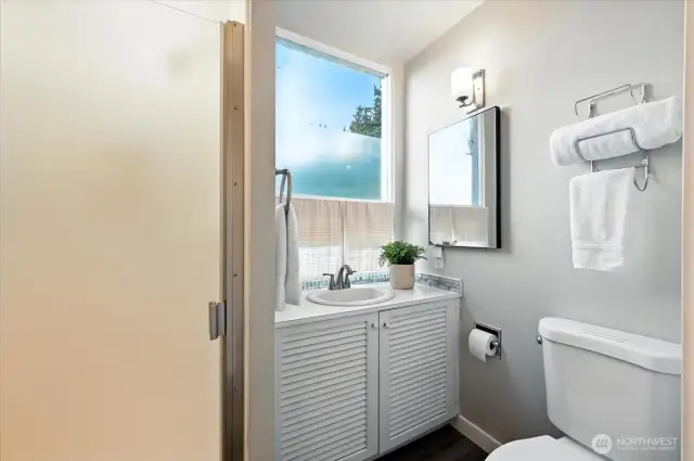 Shower on the second floor serves the primary and guest bedrooms.