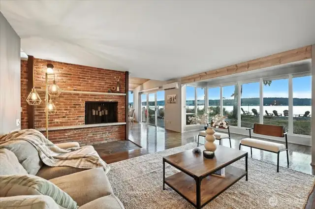 Enjoy the warmth and charm of a wood-burning fireplace in the spacious living room of this oceanfront retreat.