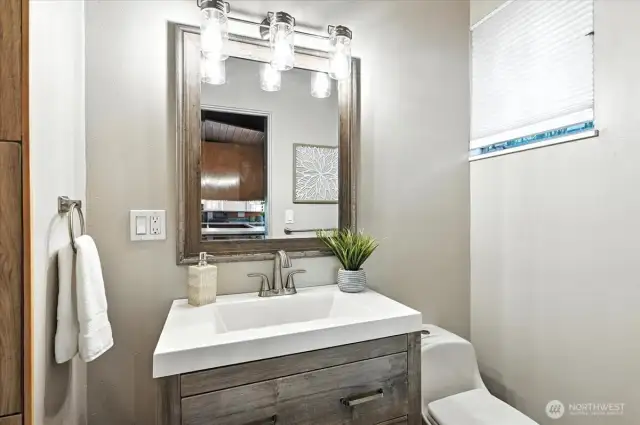 Main floor shower updated in recent times with new vanity and surround.