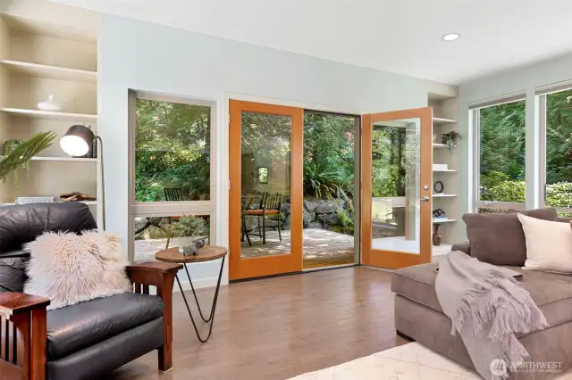 Elegant French doors open to a private side patio, perfect for morning coffee or evening wine