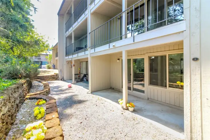 Yellow Flowers Decorate the Covered Patio and Terraced Flower Bed