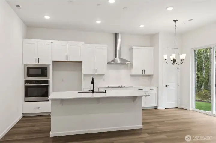 ***Actual Home *** Kitchen with large island and dining area