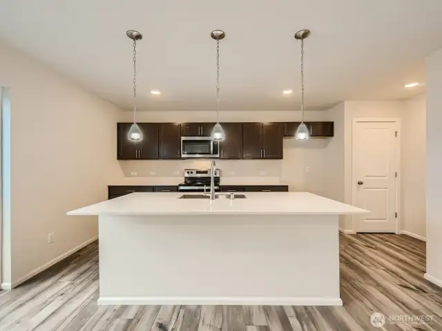 Photo is of the same model home in a different community