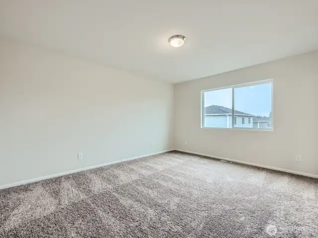 Photo is of the same model home in a different community