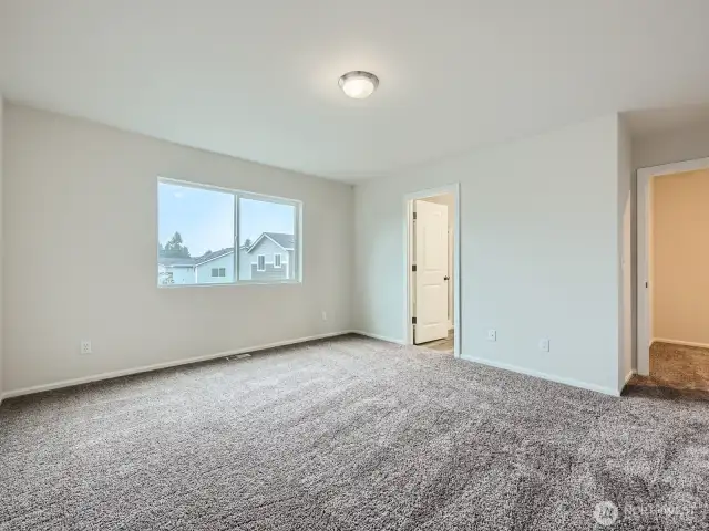 Photo is of the same model home in a different community