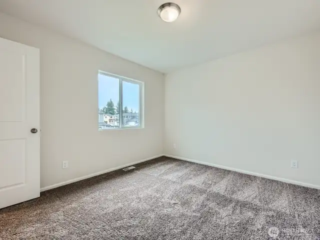Photo is of the same model home in a different community