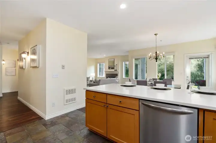 Kitchen with hallway to primary bedroom, entry and office.