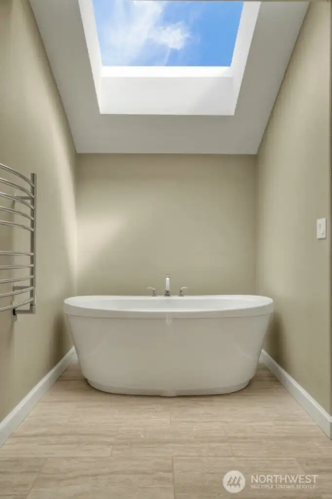 Primary bath with soaking tub, skylight
