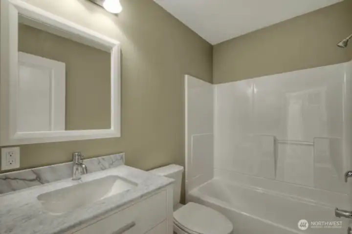 Modern full bath with stylish finishes