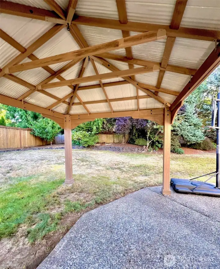 Spacious covered patio with a sturdy gazebo—perfect for year-round outdoor dining, BBQs, or gatherings, rain or shine.