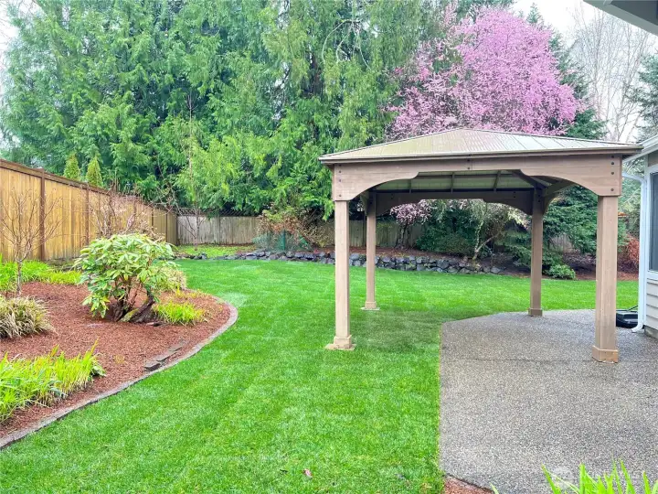 Enjoy the freshly redone landscaping and private backyard