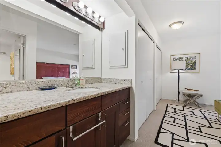 Master suite vanity with granite countertop and additional storage