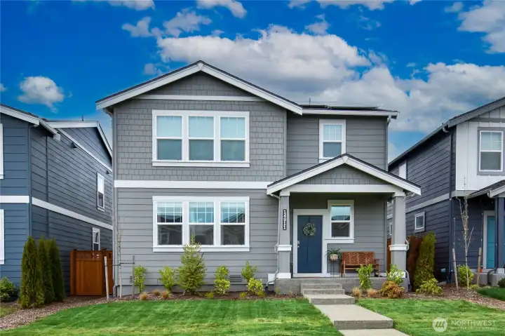 Front of the home facing the green space.