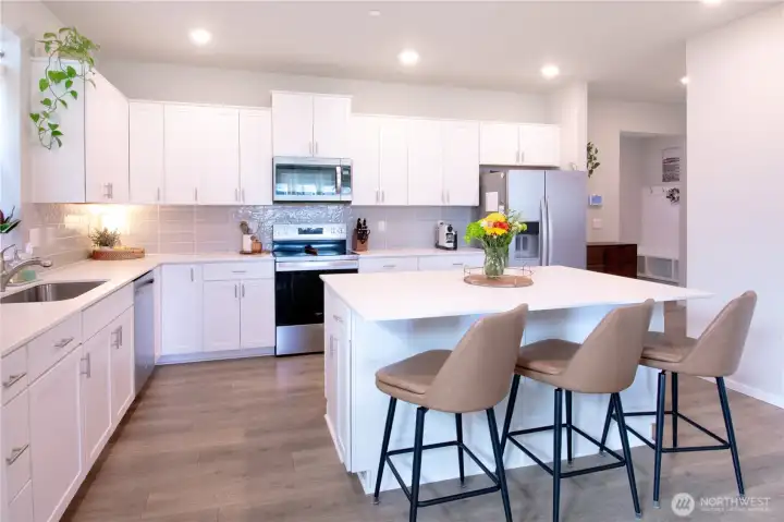 Another view of the kitchen which leads to the main level bedroom and bathroom as well as mudroom.
