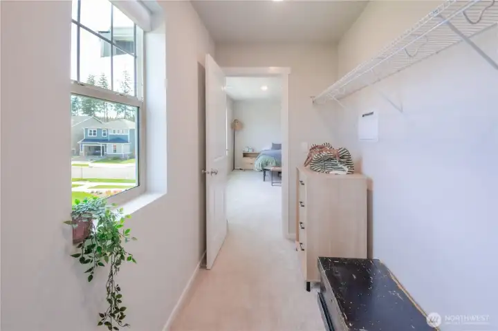 View of primary bedroom from walk-in closet.