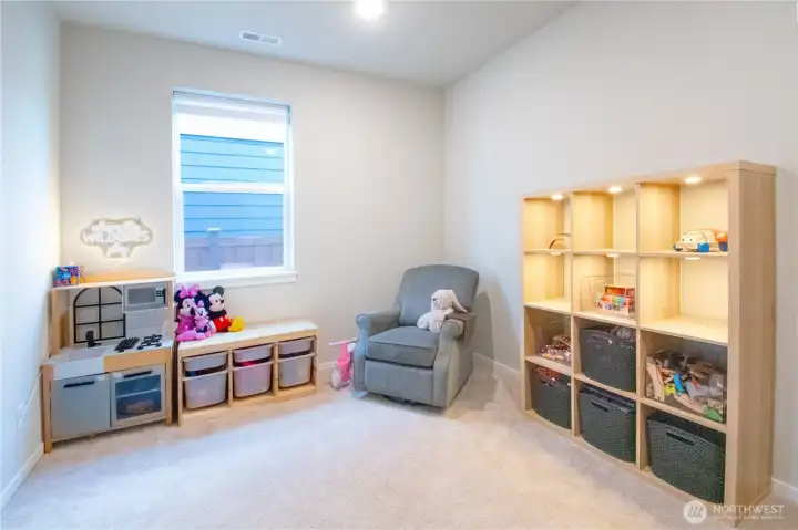 Main level bedroom staged as play room.