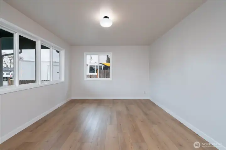 Large living room features LVP flooring and fresh interior paint throughout.