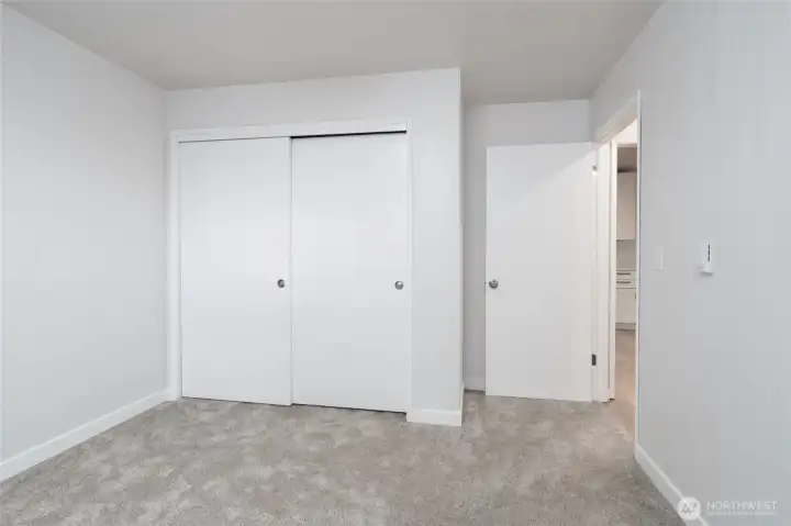 Bedroom 1- Fresh carpet, paint and fixtures!