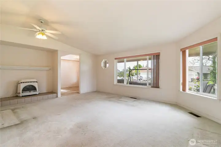 Natural gas fireplace. Ceiling fan. So many windows for natural light.