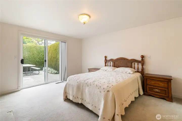 Primary bedroom with access to back yard.