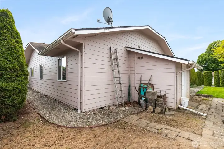 Privacy bushes to the East and additional storage shed for lawn and gardening equipment.