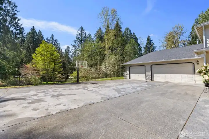 The generous driveway offers plentiful parking space and and room to shoot hoops.