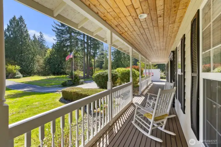 Enjoy peaceful mornings on the charming front porch overlooking the lush, private front yard.