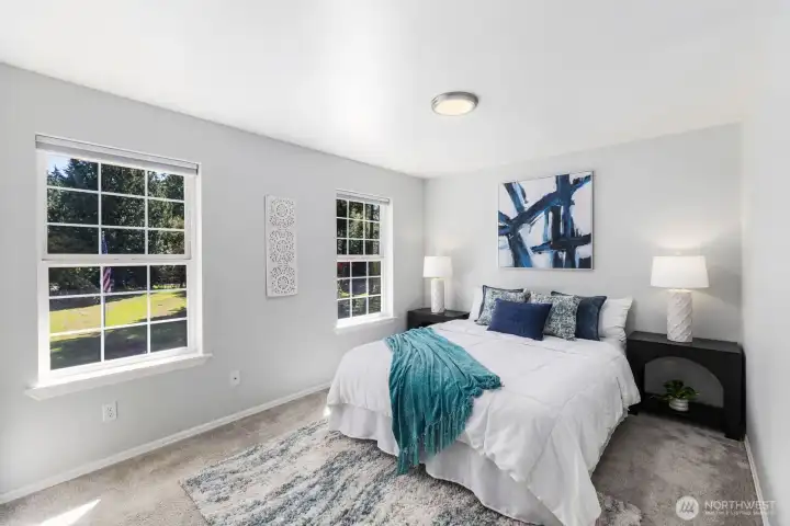 This generously sized secondary bedroom is bright and inviting.