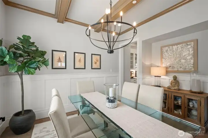 Dining room with wood beamed ceiling and chandelier