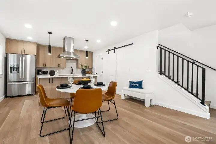 Luxury vinyl plank floors throughout the home. Note: Barn door to possible walk-in pantry.