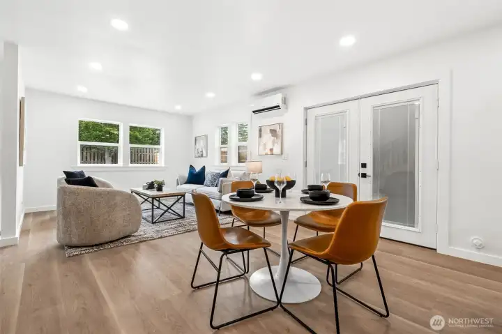 Spacious dining area with adjacent French doors to side yard.