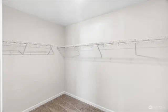 Primary bedroom walk in closet