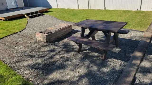 Rear yard with fireplace and picnic table