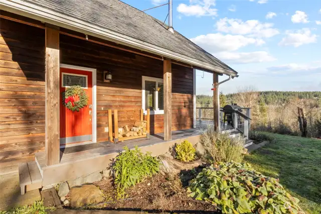 Entry to home with a wraparound deck.