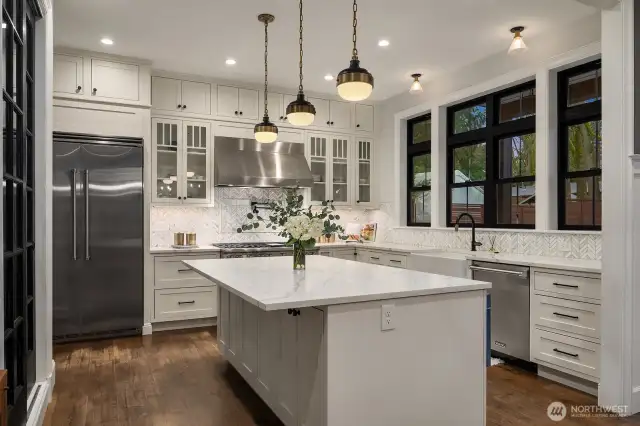 Viking appliances, quartz countertops and luxury lighting and plumbing fixtures