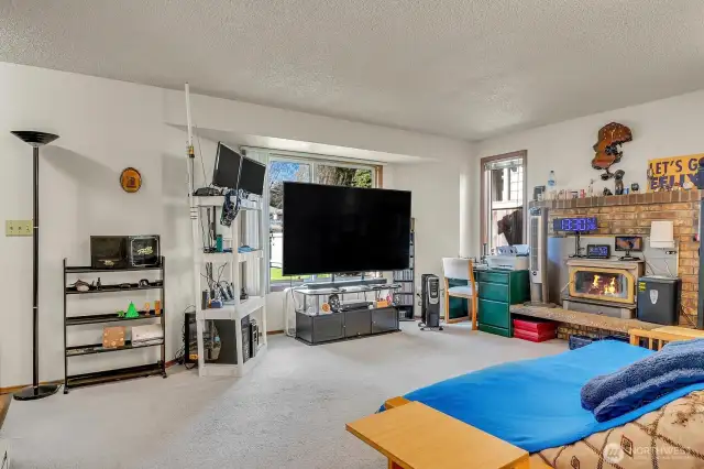 Unit A - Spacious Living Room with cozy fireplace.