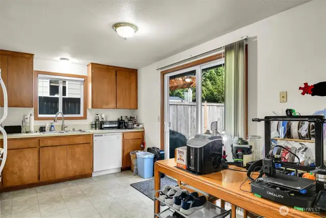 Unit A - Kitchen with slider to the patio and large fenced backyard.