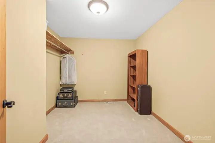 Walk-in closet for upstairs primary bedroom.