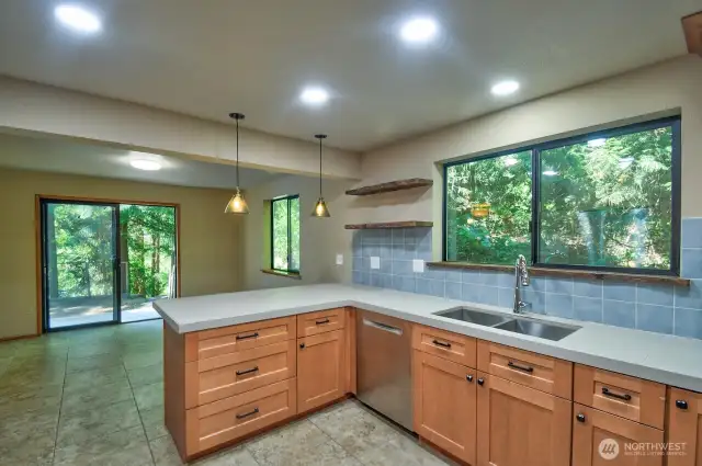 Kitchen looking toward the dining area and slider to the back yard.