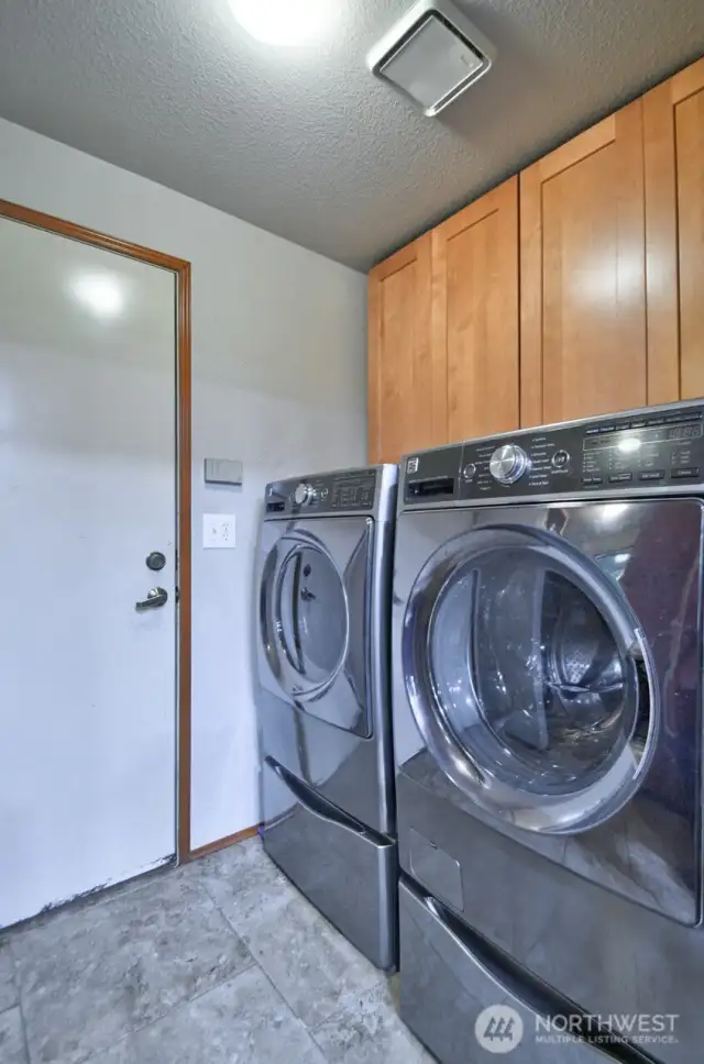 Laundry is just off of the kitchen.  Door leads to the garage. Washer and dryer are included.