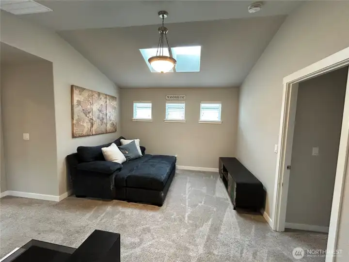 Upper loft at the top of the stairs offers flex space ideal for rec/flex room.