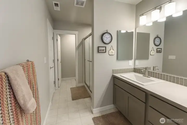 Another view of primary bath looking towards shower and toilet room.