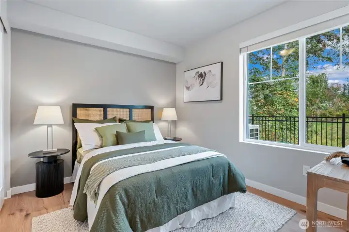 Secondary suite includes its own attached bathroom, with quartz counters, title floor and tub shower combo. Photos are of model home in the community.