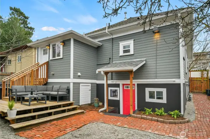 Yard (red door leads to Finished lower-level suite)