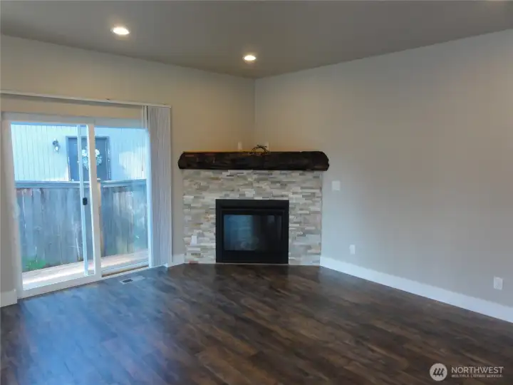 Nice living room with gas fireplace. Slider leads to deck.