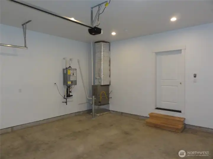 Interior garage with tankless water heater.