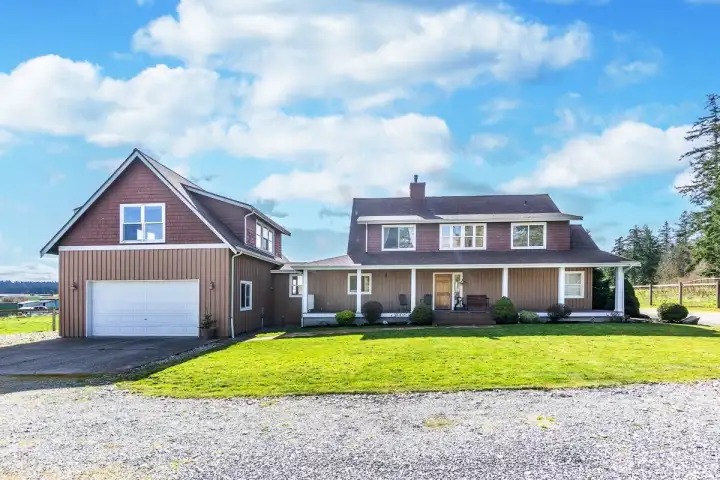 Wonderful light and bright 4 bedroom home with another finished bonus room. (3 bedroom septic system). Two car garage and a Studio Apt above the garage with separate entrance.