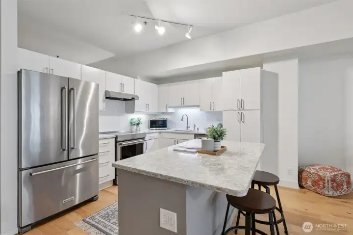 Open Floor plan with a Chef's Kitchen including Stainless Steel Appliances, Cambria Quartz countertops